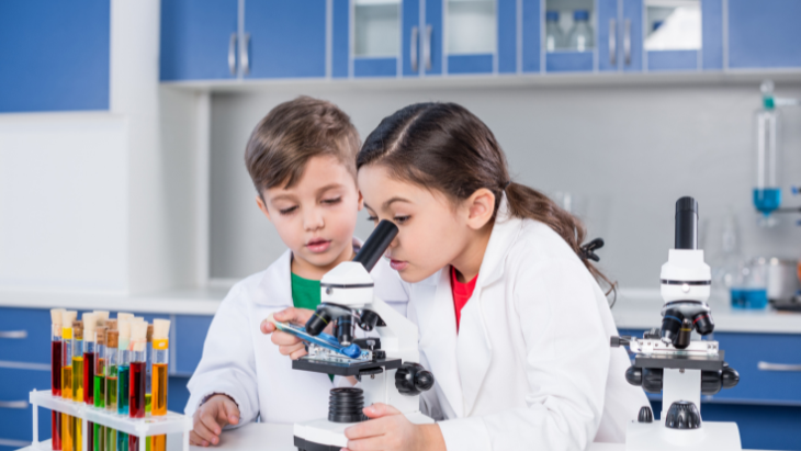 Kids using a microscope