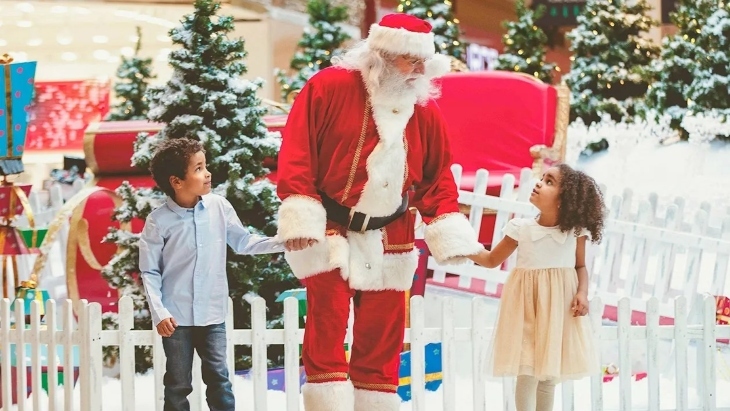 Santa walking with kids