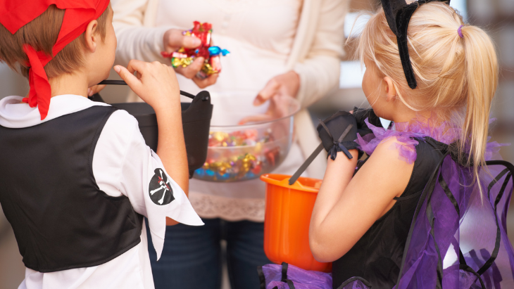 Kids collecting Halloween sweets