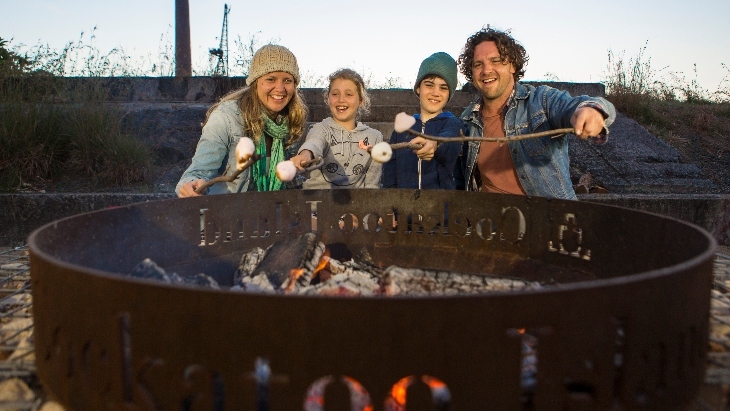 Family enjoying Cockatoo Island campground firepit