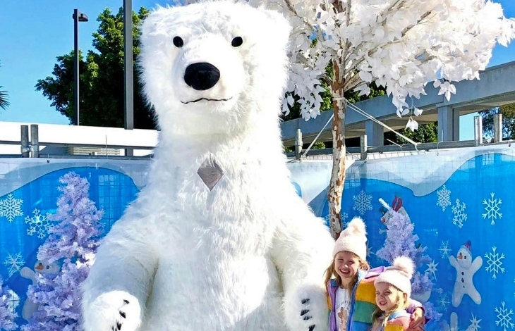 Kids hugging a polar bear