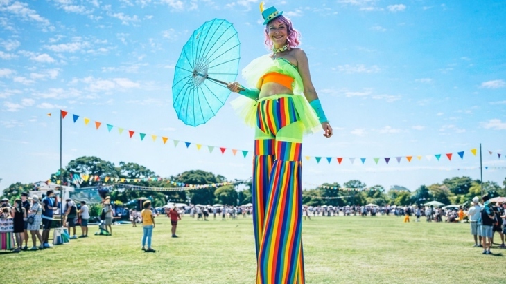 Female high walker at outdoor festival