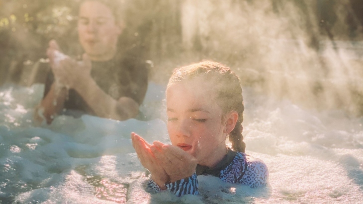 A child at Deep Blue Hot Springs