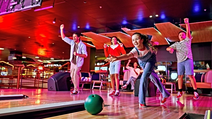 A family ten-pin bowling at Zone Bowling