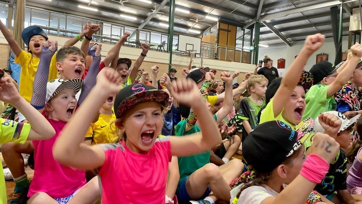 Kids cheering each other on at school holiday campe