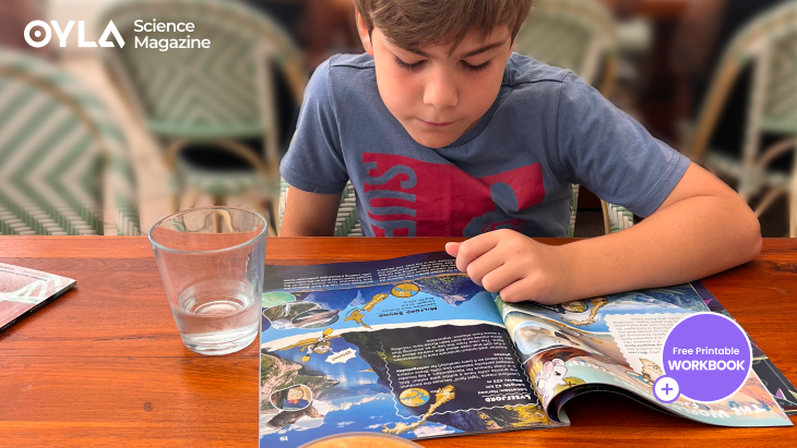 Child in cafe reading OYLA Magazine