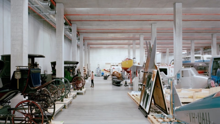 A row of old coaches and other transport items