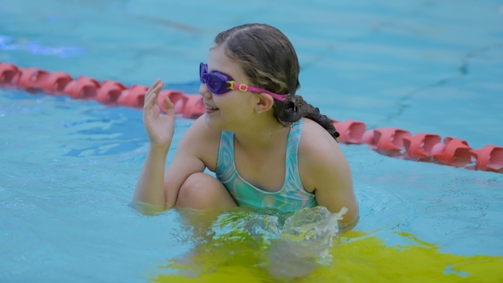 Child learning to swim