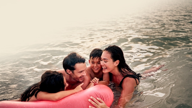 A family of four swimming