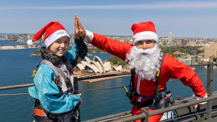 Boy and Santa atop Sydney Harbour Bridge - Santa at the Summit