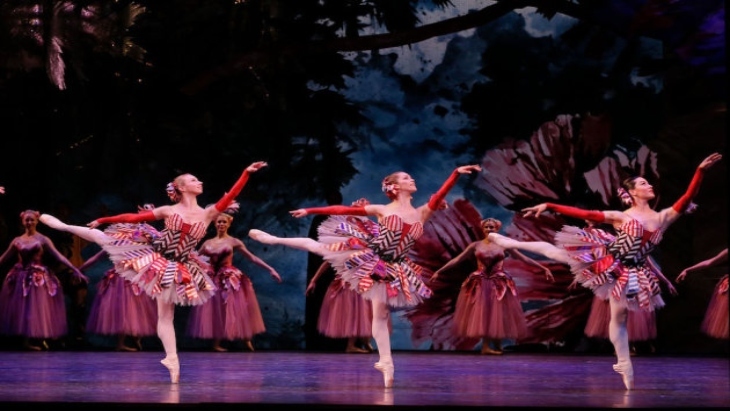 Three ballet dancers perform The Nutcracker on stage
