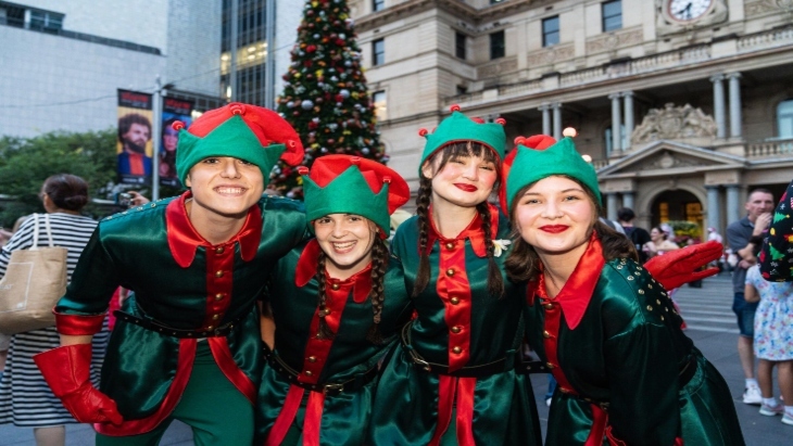 Four people dressed up as elves
