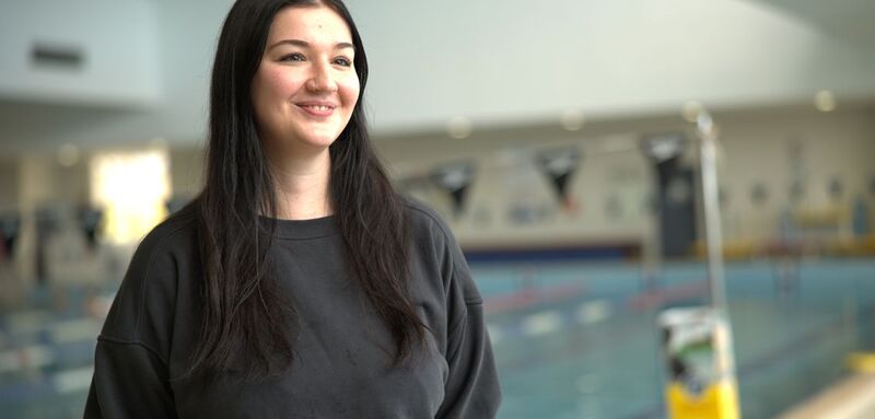 Woman standing near swimming pool