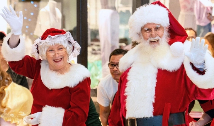 Santa and Mrs Claus waving