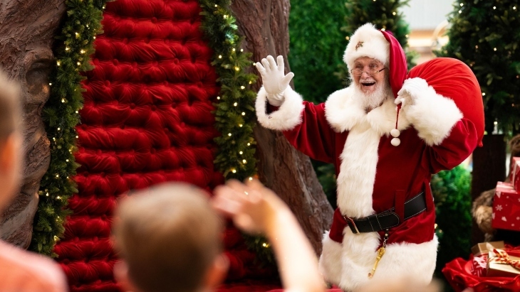 Santa waving at kids