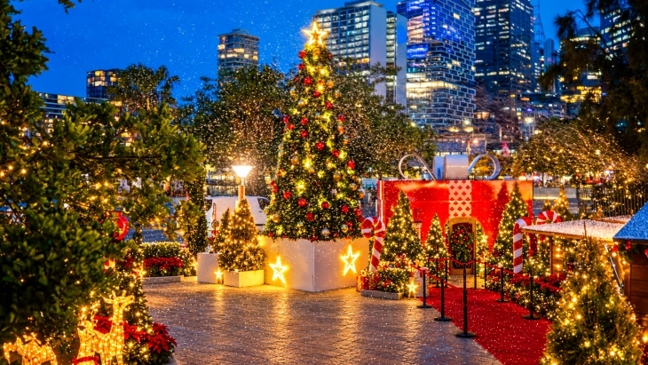 Christmas tree and decorations with falling snow Sydney harbour