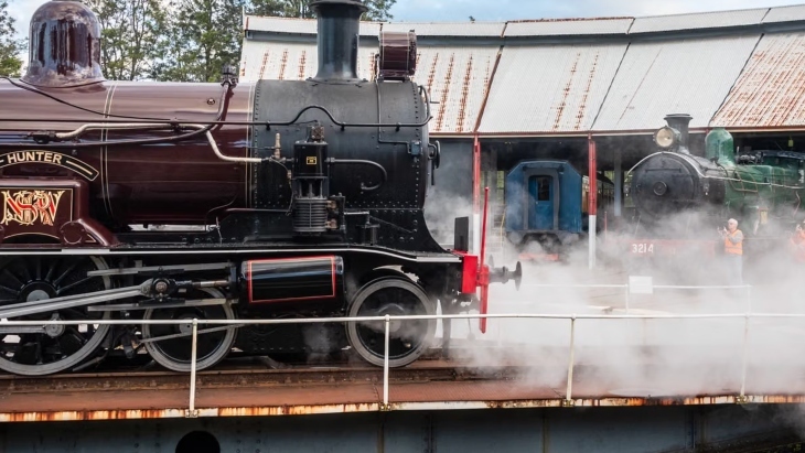Steam trains at a station