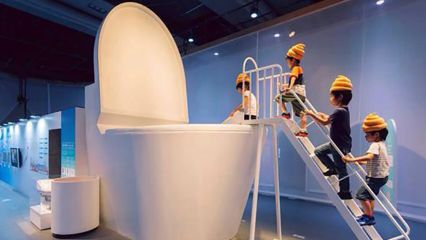 Tokyo kids wear turd hats and jump into giant loo to learn how toilets work