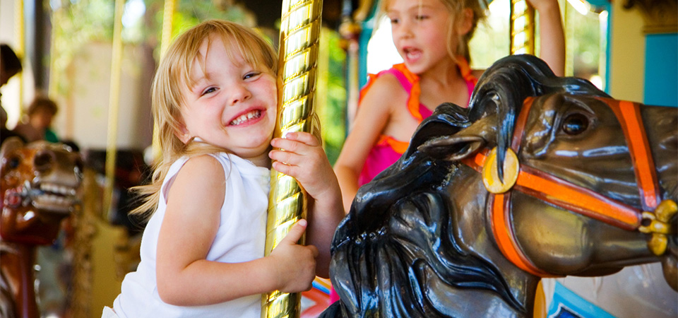 Toddler Riding the Carousel