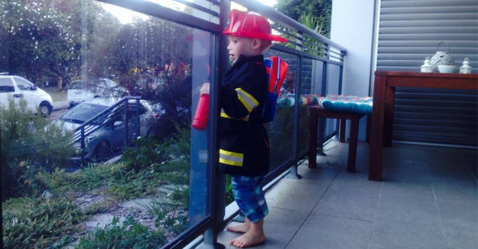 In full fireman dress up gear 