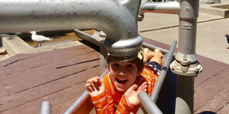 boy playing with taps